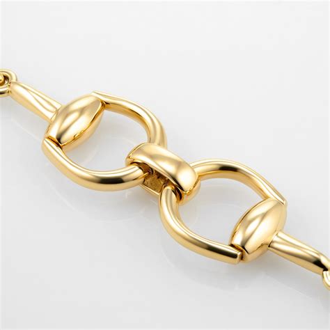 gold horsebit bracelet.